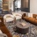 a living room with a chandelier and couches