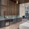 a kitchen with a bar and chairs