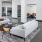 a room with white couches and a table